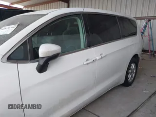 2023 Chrysler Pacifica Touring L with VIN 2C4RC1BG6PR550575, listed as a IAAI auction lot 42576498 with 54,373 mi miles and . Bid and sale history available at DreamBid. Image 14.