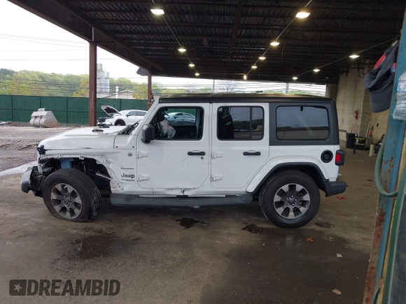 2018 Jeep Wrangler Unlimited Sahara with VIN 1C4HJXEG3JW116404, listed as a IAAI auction lot 42152506 with 57,727 mi miles and . Bid and sale history available at DreamBid. Image 14.