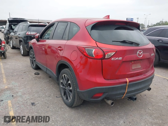 2016 Mazda CX-5 Grand Touring with VIN JM3KE2DY8G0871574, listed as a IAAI auction lot 41959686 with 95,416 mi miles and . Bid and sale history available at DreamBid. Image 3.