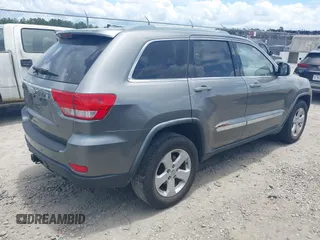 2011 Jeep Grand Cherokee Laredo with VIN 1J4RR4GG3BC595896, listed as a IAAI auction lot 42632333 with 135,426 mi miles and . Bid and sale history available at DreamBid. Image 4.