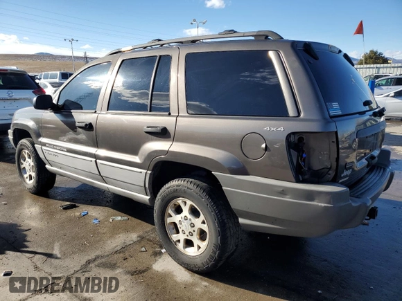 1999 Jeep Grand Cherokee Laredo with VIN 1J4GW58N9XC633464, listed as a Copart auction lot 84682454 with 212,738 mi miles and Salvage title. Bid and sale history available at DreamBid. Image 2.