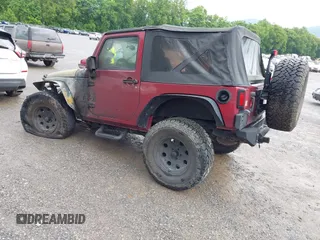 2012 Jeep Wrangler Sport with VIN 1C4AJWAG9CL203018, listed as a IAAI auction lot 42377899 with Not provided miles and . Bid and sale history available at DreamBid. Image 3.