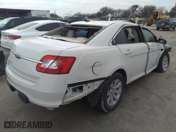 2011 Ford Taurus SE with VIN 1FAHP2DW3BG113398, listed as a IAAI auction lot 41617959 with 123,706 mi miles. Bid and sale history available at carsss.com. Image 4.