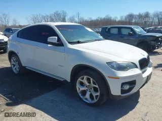 2011 BMW X6 35i with VIN 5UXFG2C58BLX07890, listed as a IAAI auction lot 42067800 with 144,367 mi miles. Bid and sale history available at carsss.com. Image 1.