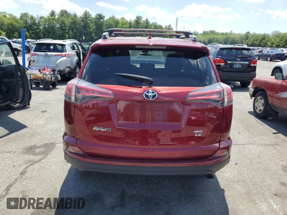 2018 Toyota RAV4 LE with VIN 2T3BFREVXJW838680, listed as a Copart auction lot 61452055 with 79,016 mi miles and Salvage title. Bid and sale history available at DreamBid. Image 6.