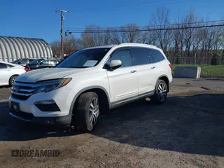 2016 Honda Pilot Touring with VIN 5FNYF6H98GB017079, listed as a IAAI auction lot 42055272 with 142,726 mi miles and . Bid and sale history available at DreamBid. Image 2.