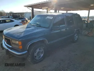 1999 GMC Yukon with VIN 1GKEK13R3XJ750307, listed as a Copart auction lot 84728104 with 212,879 mi miles and Salvage Title. Bid and sale history available at carsss.com. Image 1.