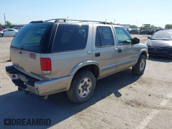 2003 Chevrolet Blazer LS z VIN 1GNDT13X63K146670, wystawiony jako IAAI lot #42200426 z przebiegiem 129 516 mil mil oraz . Historia ofert i sprzedaży dostępna na DreamBid. Obrazek 4.