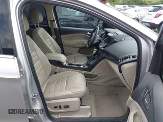 2016 Ford Escape Titanium with VIN 1FMCU9J95GUB93585, listed as a IAAI auction lot 42614106 with 124,465 mi miles and . Bid and sale history available at DreamBid. Image 5.