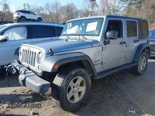 2015 Jeep Wrangler Unlimited Sport with VIN 1C4BJWDG4FL732123, listed as a IAAI auction lot 41864714 with 142,382 mi miles. Bid and sale history available at carsss.com. Image 2.