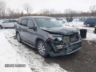 2019 Honda Pilot EX-L with VIN 5FNYF6H58KB010283, listed as a IAAI auction lot 41592114 with 100,745 mi miles. Bid and sale history available at carsss.com. Image 1.