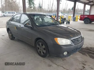 2005 Kia Spectra LX with VIN KNAFE121855162859, listed as a IAAI auction lot 41766145 with 220,795 mi miles. Bid and sale history available at carsss.com. Image 1.