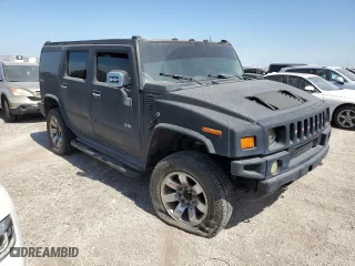 2003 Hummer H2 with VIN 5GRGN23U13H143781, listed as a Copart auction lot 74318724 with 0 mi miles and Salvage Title. Bid and sale history available at carsss.com. Image 4.