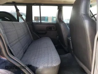 1999 Jeep Cherokee Sport z VIN 1J4FF68S8XL604061, wystawiony jako Copart lot #53175345 z przebiegiem 206 698 mil mil oraz Nie do naprawy • Non repairable. Historia ofert i sprzedaży dostępna na DreamBid. Obrazek 11.