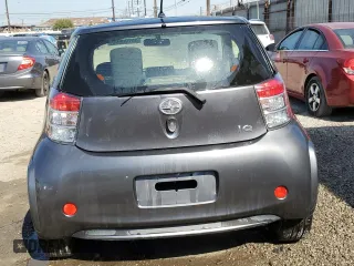 2014 Scion iQ with VIN JTNJJXB0XEJ029610, listed as a Copart auction lot 46700905 with 135,381 mi miles and Salvage Title. Bid and sale history available at carsss.com. Image 6.