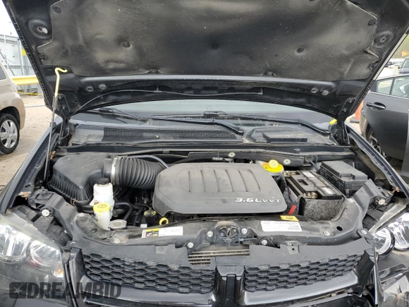 2015 Dodge Grand Caravan American Value with VIN 2C4RDGBG6FR659777, listed as a Copart auction lot 53847385 with 176,802 mi miles and Salvage Title. Bid and sale history available at DreamBid. Image 12.