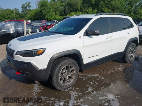 2021 Jeep Cherokee Trailhawk with VIN 1C4PJMBX4MD124980, listed as a IAAI auction lot 42372537 with 55,667 mi miles and . Bid and sale history available at DreamBid. Image 2.