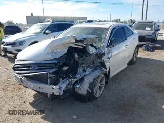 2015 Ford Taurus SEL z VIN 1FAHP2E81FG105404, wystawiony jako IAAI lot #40888773 z przebiegiem Nie podano mil oraz . Historia ofert i sprzedaży dostępna na DreamBid. Obrazek 6.