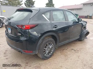 2017 Mazda CX-5 Sport with VIN JM3KFBBL5H0201857, listed as a IAAI auction lot 40885161 with 87,464 mi miles. Bid and sale history available at carsss.com. Image 4.