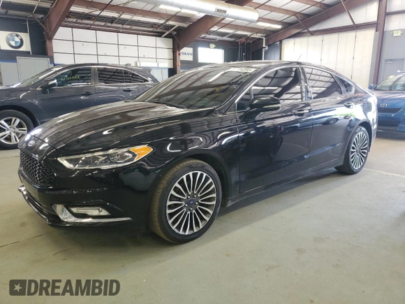 2017 Ford Fusion Titanium z VIN 3FA6P0K96HR124759, wystawiony jako Copart lot #61414395 z przebiegiem 175 655 mil mil oraz Czysty tytuł • Clean title. Historia ofert i sprzedaży dostępna na DreamBid. Obrazek 1.