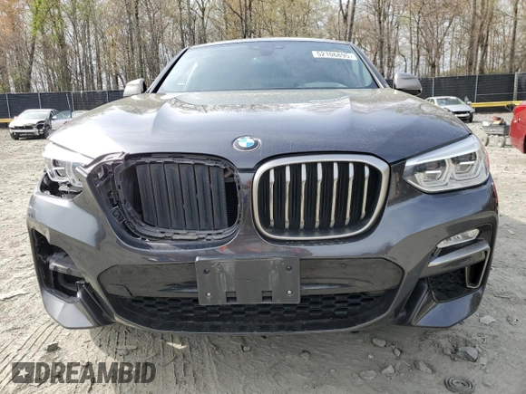 2019 BMW X4 M40i with VIN 5UXUJ5C5XKLJ64004, listed as a Copart auction lot 52106895 with 74,599 mi miles and Salvage title. Bid and sale history available at DreamBid. Image 5.