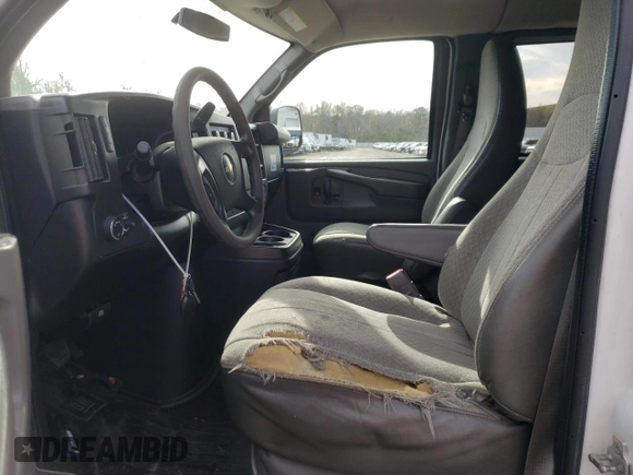 2014 Chevrolet Express Passenger LT with VIN 1GAZG1FG2E1202457, listed as a Copart auction lot 82704884 with 142,982 mi miles and Salvage title. Bid and sale history available at DreamBid. Image 7.