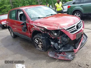 2011 Volkswagen Tiguan SEL w/Premium Navi z VIN WVGAV7AX8BW000446, wystawiony jako IAAI lot #42200353 z przebiegiem 245 197 mil mil oraz . Historia ofert i sprzedaży dostępna na DreamBid. Obrazek 1.