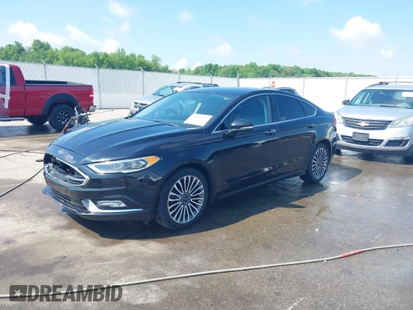 2017 Ford Fusion SE with VIN 3FA6P0T94HR321704, listed as a IAAI auction lot 42253691 with 129,115 mi miles and . Bid and sale history available at DreamBid. Image 2.
