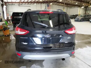 2016 Ford Escape SE with VIN 1FMCU9GX1GUC24692, listed as a Copart auction lot 88102815 with 114,900 mi miles and Salvage Title. Bid and sale history available at DreamBid. Image 6.