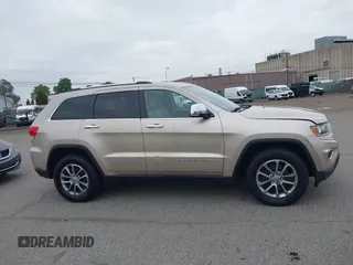 2014 Jeep Grand Cherokee Limited z VIN 1C4RJFBG8EC408754, wystawiony jako IAAI lot #42612211 z przebiegiem 149 017 mil mil oraz . Historia ofert i sprzedaży dostępna na DreamBid. Obrazek 13.