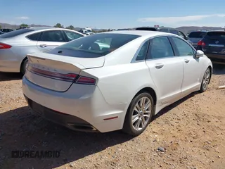 2016 Lincoln MKZ z VIN 3LN6L2GK1GR604523, wystawiony jako IAAI lot #42005012 z przebiegiem 215 285 mil mil oraz . Historia ofert i sprzedaży dostępna na DreamBid. Obrazek 4.