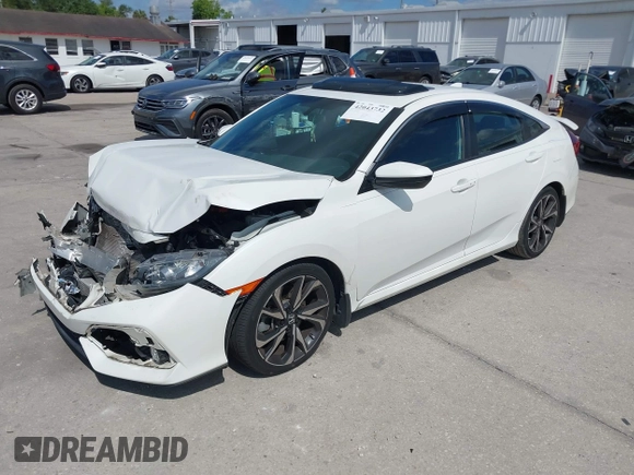 2018 Honda Civic Si with VIN 2HGFC1E53JH700251, listed as a IAAI auction lot 42043732 with 104,763 mi miles and . Bid and sale history available at DreamBid. Image 2.