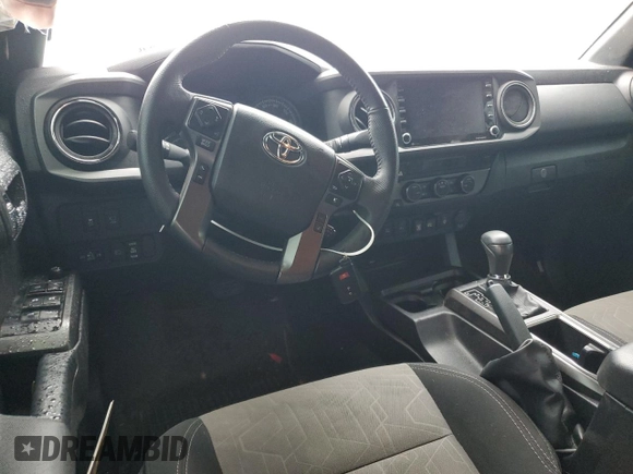 2023 Toyota Tacoma SR with VIN 3TMCZ5AN4PM566647, listed as a Copart auction lot 64062034 with 43,154 mi miles and Salvage title. Bid and sale history available at DreamBid. Image 8.