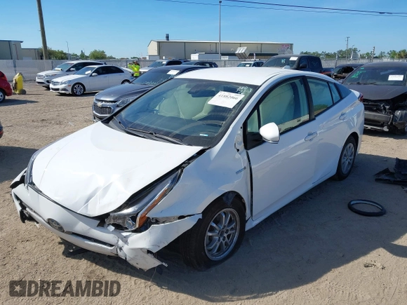 2021 Toyota Prius L Eco with VIN JTDKAMFU2M3147562, listed as a IAAI auction lot 41882066 with 99,491 mi miles. Bid and sale history available at carsss.com. Image 17.