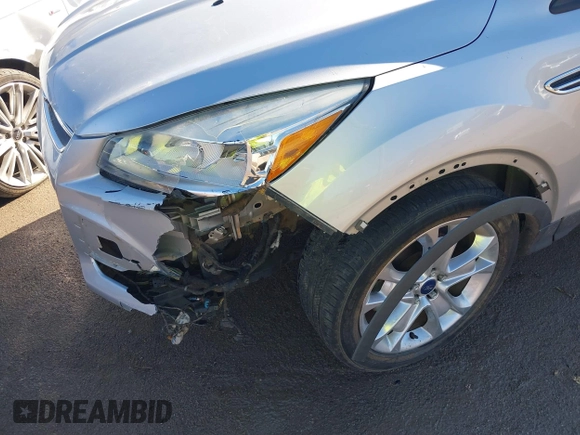 2014 Ford Escape Titanium with VIN 1FMCU0JX7EUC59643, listed as a IAAI auction lot 41082952 with 143,899 mi miles. Bid and sale history available at carsss.com. Image 6.
