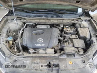 2016 Mazda CX-5 Touring z VIN JM3KE2CY4G0805072, wystawiony jako Copart lot #58435535 z przebiegiem 146 323 mil mil oraz Szkoda całkowita • Salvage title. Historia ofert i sprzedaży dostępna na DreamBid. Obrazek 11.