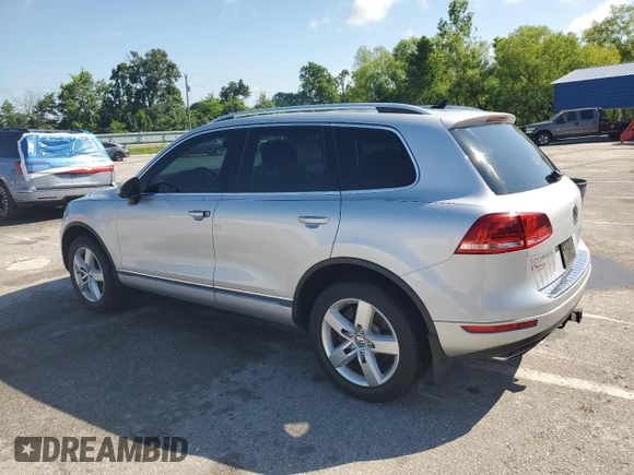 2014 Volkswagen Touareg Lux with VIN WVGEF9BP1ED012267, listed as a Copart auction lot 58924055 with 81,009 mi miles and Salvage title. Bid and sale history available at DreamBid. Image 2.