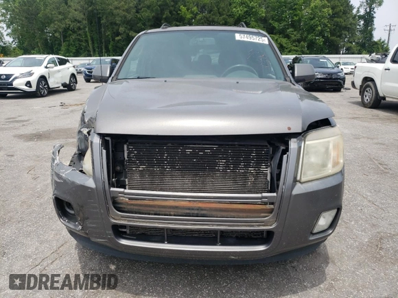 2011 Mercury Mariner Premier z VIN 4M2CN8HG8BKJ07653, wystawiony jako Copart lot #57495725 z przebiegiem 105 624 mil mil oraz Szkoda całkowita • Salvage title. Historia ofert i sprzedaży dostępna na DreamBid. Obrazek 5.