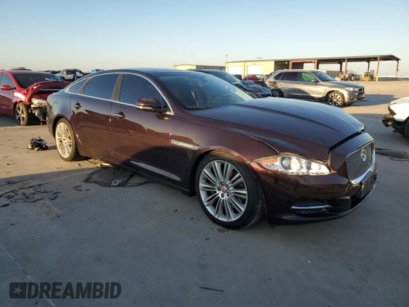 2015 Jaguar XJ Portfolio with VIN SAJWA2GZ7F8V83492, listed as a Copart auction lot 43789355 with 132,020 mi miles and Salvage Title. Bid and sale history available at carsss.com. Image 4.