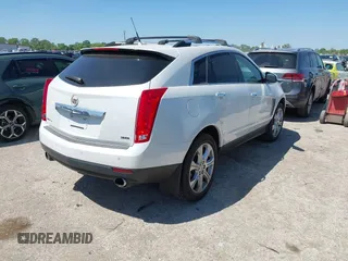 2014 Cadillac SRX Performance Collection with VIN 3GYFNFE35ES582897, listed as a IAAI auction lot 41978361 with 144,116 mi miles and . Bid and sale history available at DreamBid. Image 4.