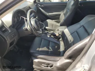 2014 Mazda CX-5 Grand Touring with VIN JM3KE4DY4E0305212, listed as a Copart auction lot 53145305 with 233,061 mi miles and Salvage Title. Bid and sale history available at carsss.com. Image 7.