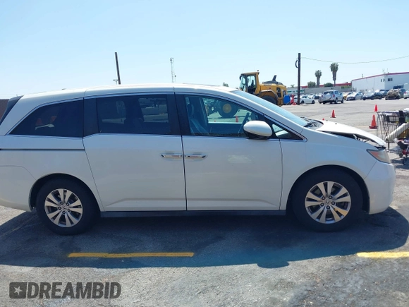 2015 Honda Odyssey EX-L with VIN 5FNRL5H67FB017554, listed as a IAAI auction lot 41974821 with 76,130 mi miles and . Bid and sale history available at carsss.com. Image 13.