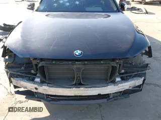 2014 BMW 7 Series 740Li with VIN WBAYE4C56ED137847, listed as a IAAI auction lot 39452255 with 184,471 mi miles. Bid and sale history available at carsss.com. Image 6.