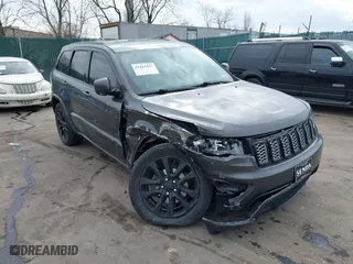 2018 Jeep Grand Cherokee Laredo E with VIN 1C4RJFAG4JC464783, listed as a IAAI auction lot 41664453 with 106,466 mi miles. Bid and sale history available at carsss.com. Image 1.