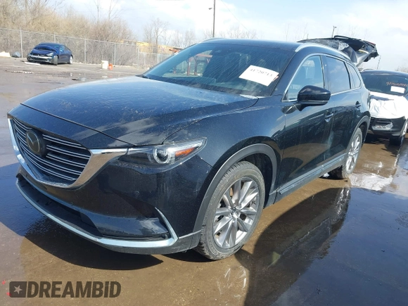2020 Mazda CX-9 Grand Touring with VIN JM3TCBDY2L0413839, listed as a IAAI auction lot 41720713 with 48,964 mi miles and . Bid and sale history available at DreamBid. Image 2.