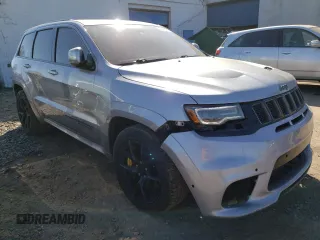 2018 Jeep Grand Cherokee with VIN NJ1454E, listed as a Copart auction lot 48051693 with 66,894 mi miles and Salvage title. Bid and sale history available at DreamBid. Image 4.