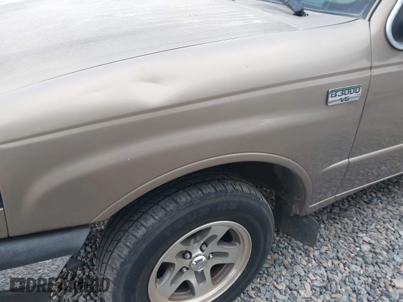 2003 Mazda B-Series 2WD Truck SE with VIN 4F4YR46VX3TM16294, listed as a IAAI auction lot 42034107 with 165,007 mi miles. Bid and sale history available at carsss.com. Image 14.