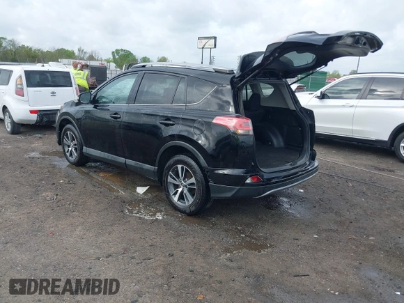 2018 Toyota RAV4 XLE with VIN 2T3WFREV9JW412755, listed as a IAAI auction lot 41889960 with 216,451 mi miles and . Bid and sale history available at carsss.com. Image 3.