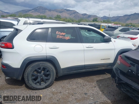 2018 Jeep Cherokee Trailhawk with VIN 1C4PJMBX3JD548761, listed as a IAAI auction lot 42107376 with 148,525 mi miles and . Bid and sale history available at DreamBid. Image 12.