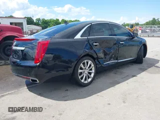2014 Cadillac XTS Luxury z VIN 2G61N5S30E9170305, wystawiony jako IAAI lot #42223317 z przebiegiem 103 692 mil mil oraz . Historia ofert i sprzedaży dostępna na DreamBid. Obrazek 4.